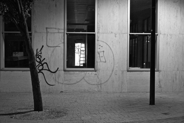 Night scene of wall with graffite